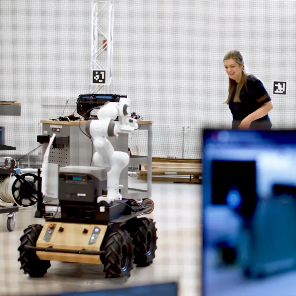 Anna Adamczyk testing an environmental robotics mission with a ground robot in the lab